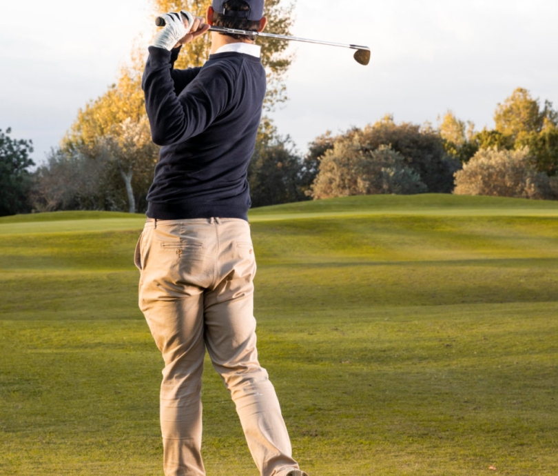 back-view-man-playing-grassy-golf-field-1024x1024